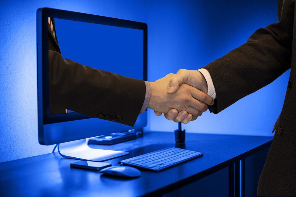 Handshake from a computer screen