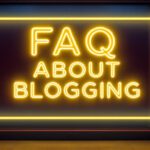 A neon sign that says FAQ About Blogging